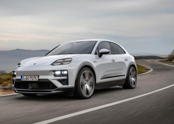 2025 Porsche Macan EV driving on twisty road