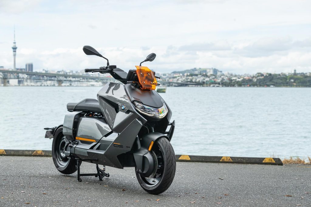 2023 BMW CE-04 front quarter shot in front of Auckland cityscape