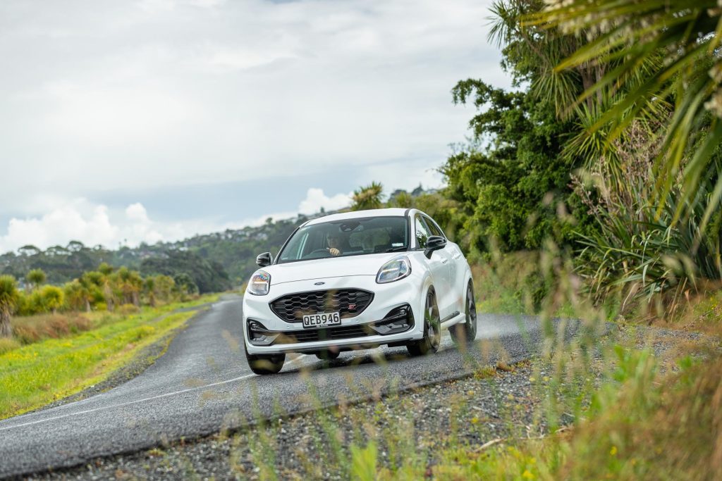 Ford Puma ST cornering hard in the rain