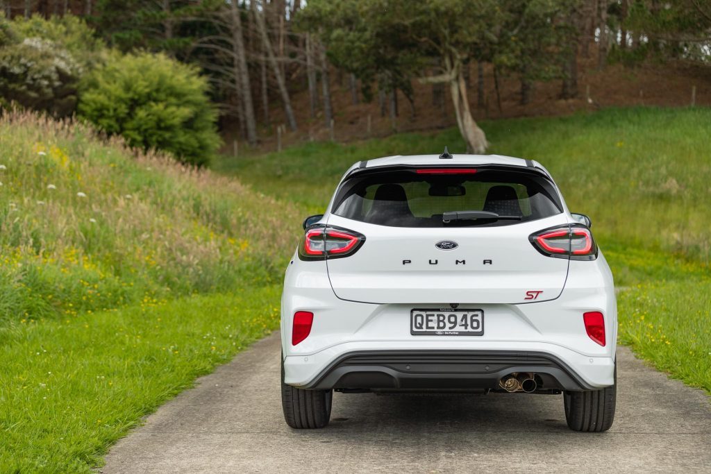 Rear profile of the Ford Puma ST, parked in a meadow