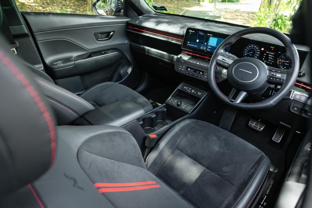 Front seats of the Hyundai Kona 1.6T N Line Limited, with red trim on seats