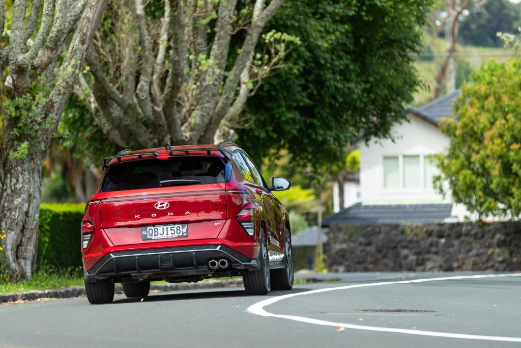 Hyundai Kona 1.6T N Line cornering rear shot, showing rear wings and diffuser style bumper