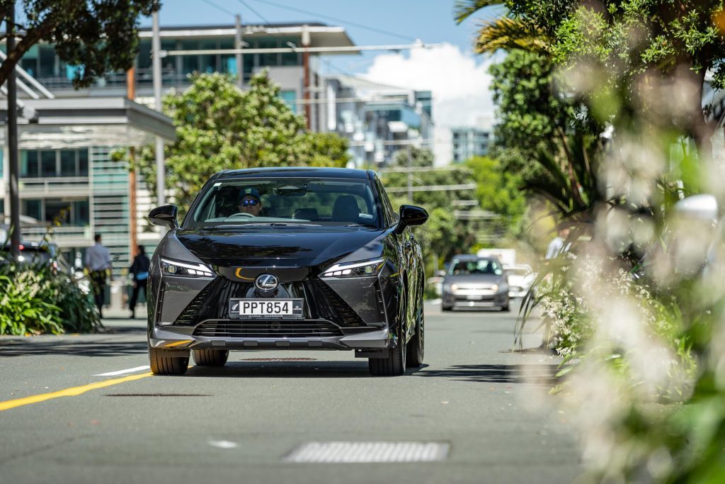 Lexus RZ 450e Dynamic front view driving in Auckland