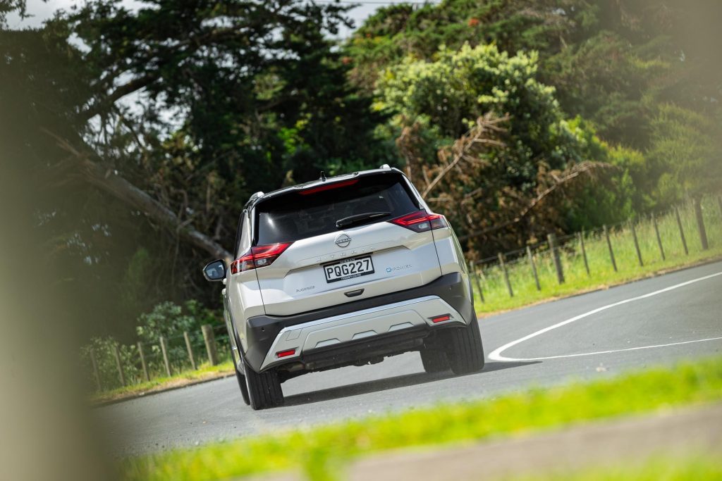 Nissan X-Trail e-Power Ti-L rear view taking a corner at pace