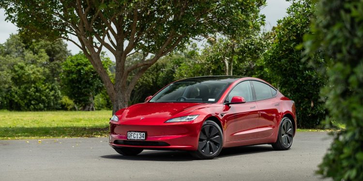 Tesla Model 3 RWD facelift front quarter angle, in red