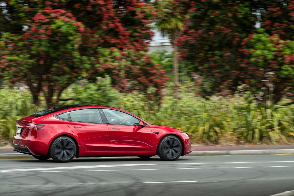 Tesla Model 3 RWD facelift side profile panning shot