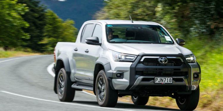 2023 Toyota Hilux SR5 Cruiser driving around corner on country road