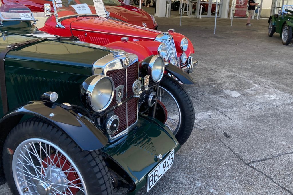 Two classic MG cars parked next to each other at Centennial Celebration in Auckland