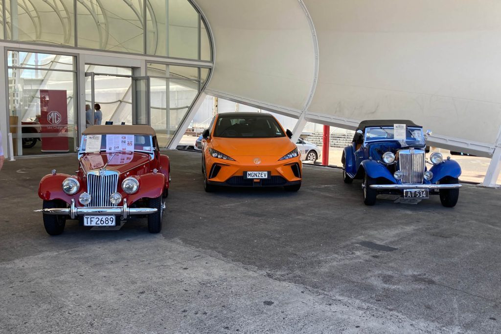 Old MGs parked next to electric MG4 at Centennial Celebration in Auckland