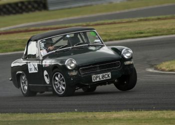 MG Midget driving around corner on race track