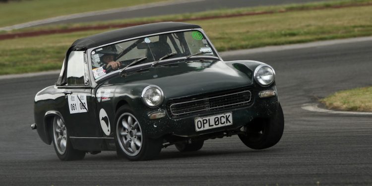 MG Midget driving around corner on race track