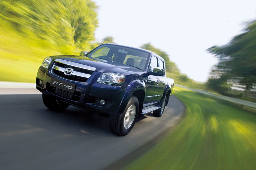 2006 Mazda BT-50 driving on road in countryside