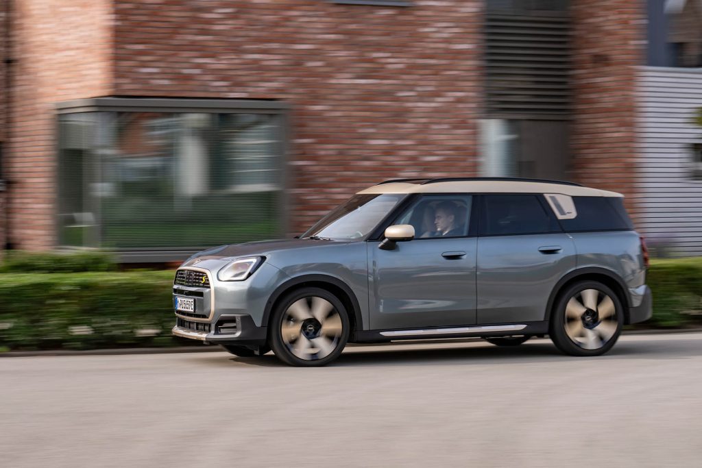 2024 Mini Countryman SE driving past brick house