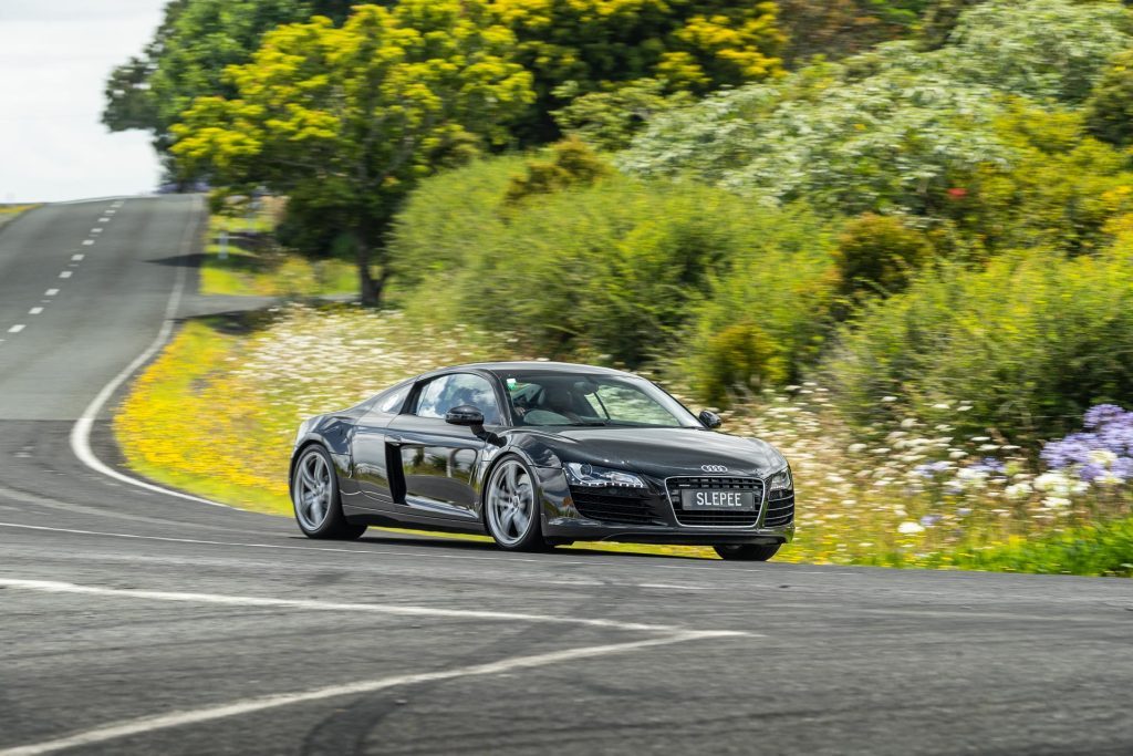 Cornering black Audi R8, first generation