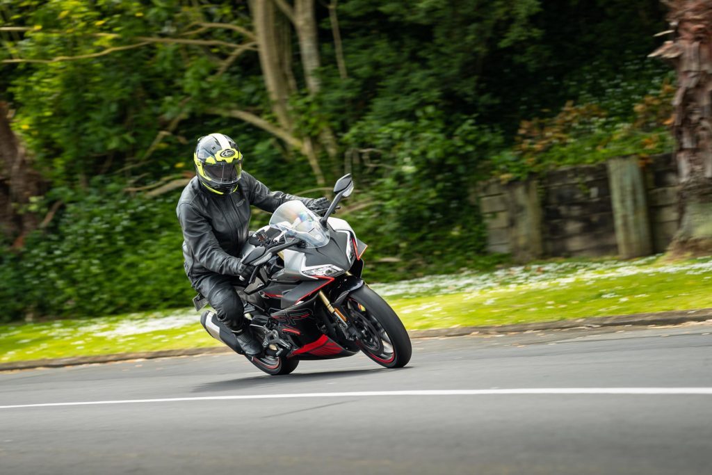 CFMoto 450 SR, with red accents, taking a corner