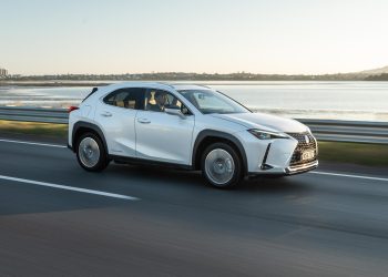 Lexus UX300e Limited in white, driving on the Auckland motorway