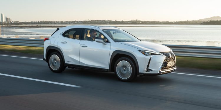 Lexus UX300e Limited in white, driving on the Auckland motorway
