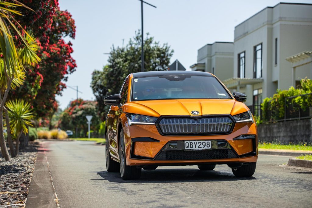 Front driving shot of the Skoda Enyaq 80 Coupe on a suburban street