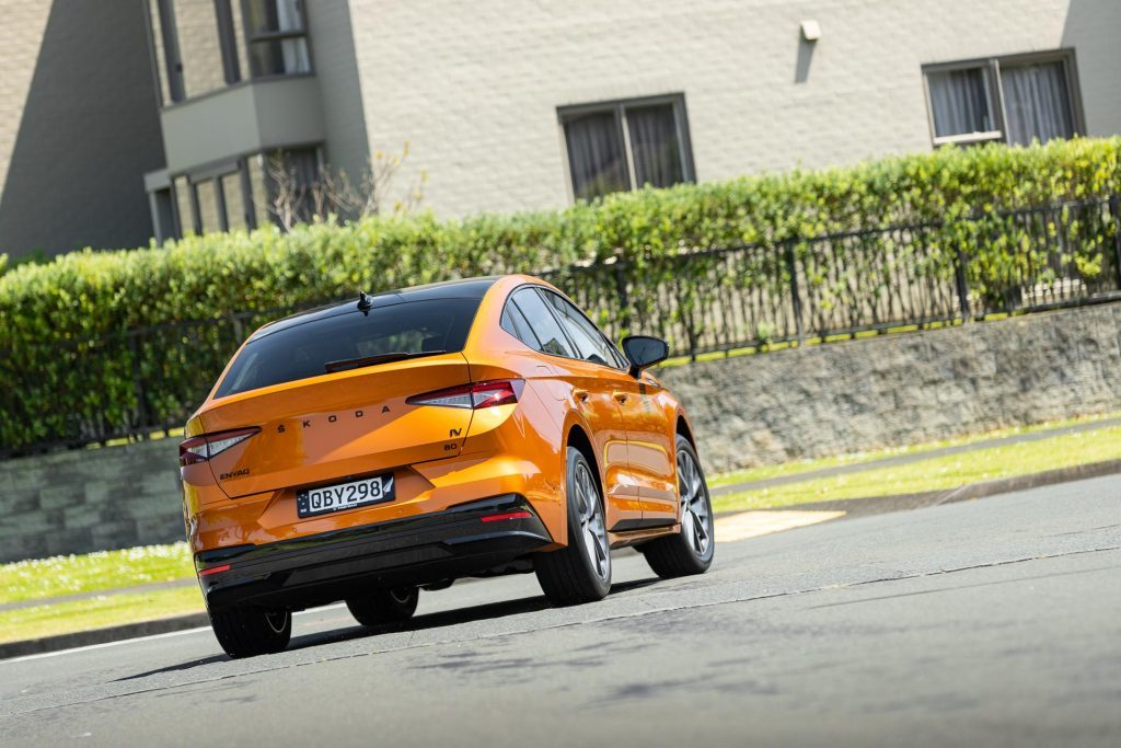 Skoda Enyaq 80 Coupe Sportline Max taking a corner, shown from the rear