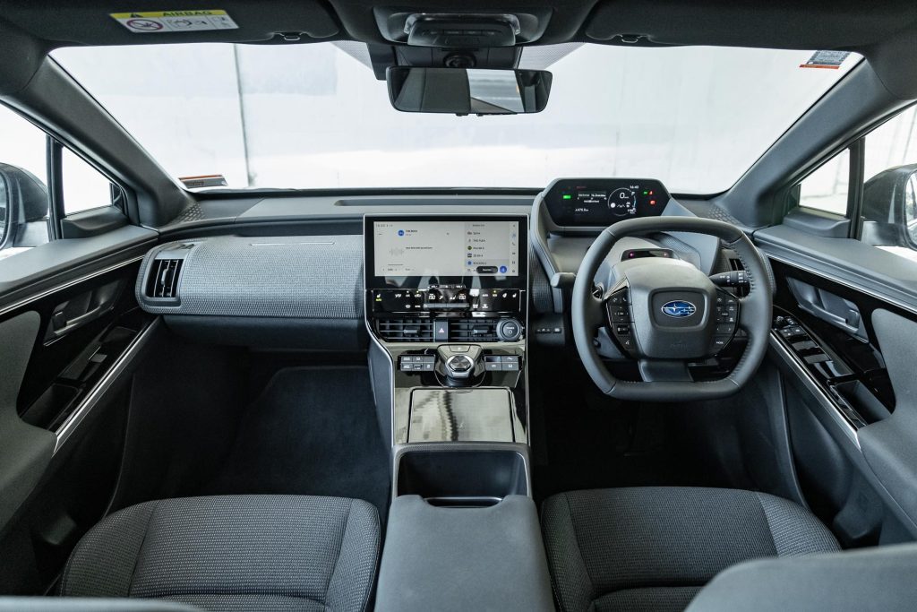 Wide interior view in the Subaru Solterra, showing front seats and dash