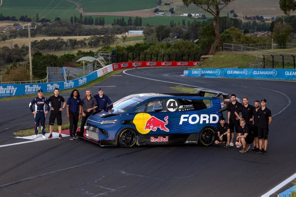 Team members standing next to Ford SuperVan 4.2 at Bathurst