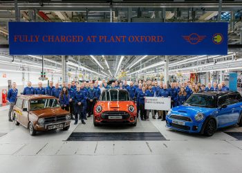 Workers surrounding three generations of Mini Clubman at Oxford plant