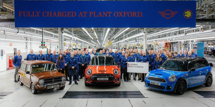 Workers surrounding three generations of Mini Clubman at Oxford plant