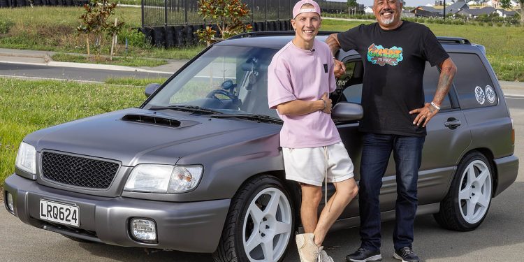 Liam Lawson standing with Mike King next to Subaru Forester charity project car