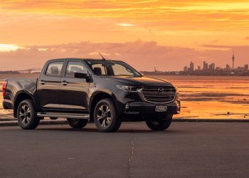 2020 Mazda BT-50 parked in front of Auckland city skyline at sunset