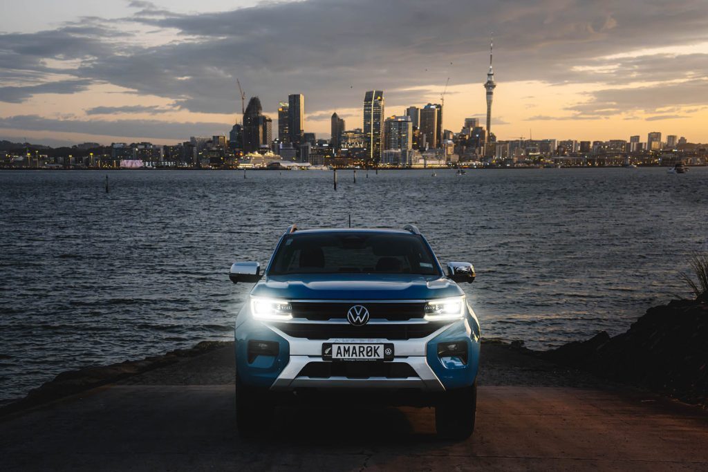 Volkswagen Amarok Aventura petrol parked in front of Auckland city skyline