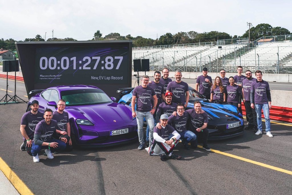 People celebrating 2024 Porsche Taycan Turbo GT with Weissach package new lap record at Laguna Seca