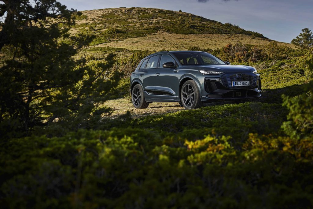 2025 Audi Q6 e-tron front three quarter view in trees