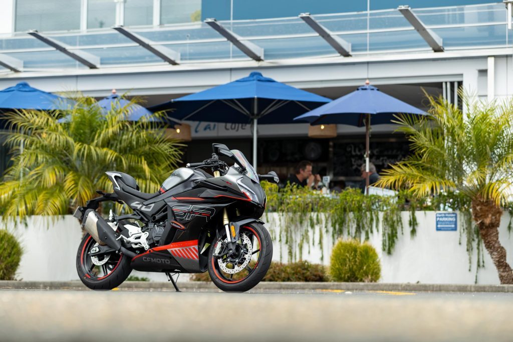 CFMoto 450 SR parked in front of a cafe