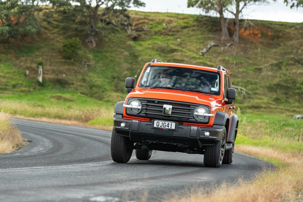 GWM Tank 300 LUX in orange, taking a corner