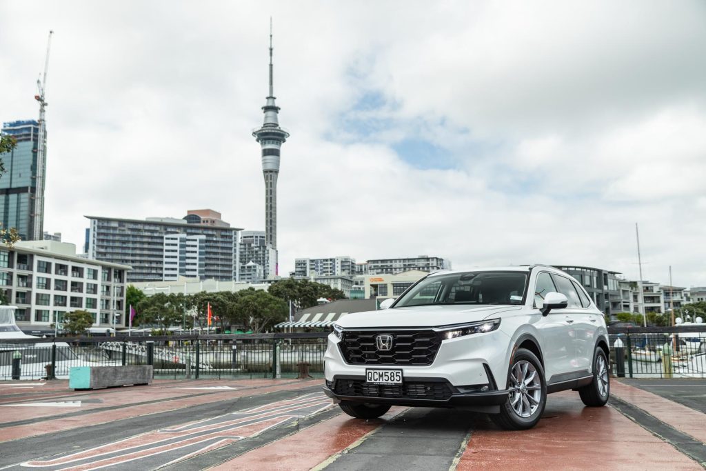 Honda CR-V Sport 7 seater in white, parked in front of the Auckland Skytower