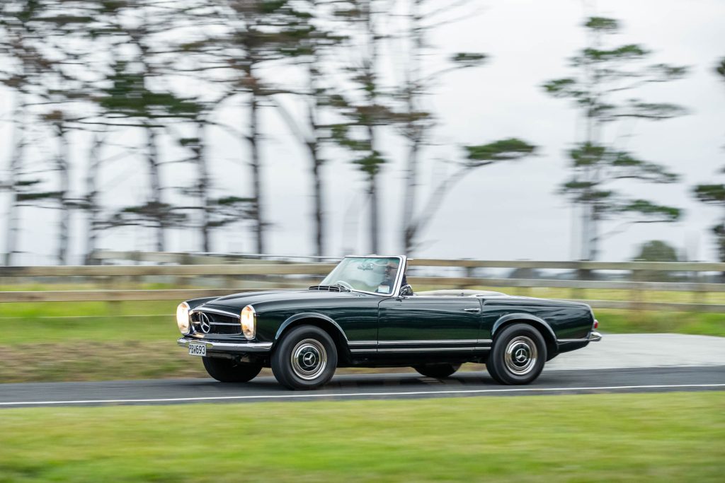 Mercedes-Benz 230 SL in green, flyby panning shot