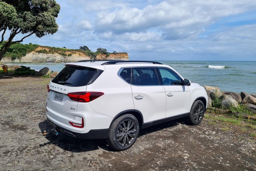 White SsangYong Rexton SPR, parked near the beach, showing rear quarter