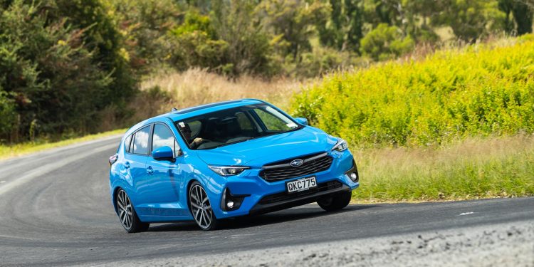 Front cornering shot of the 2024 Subaru Impreza, in blue