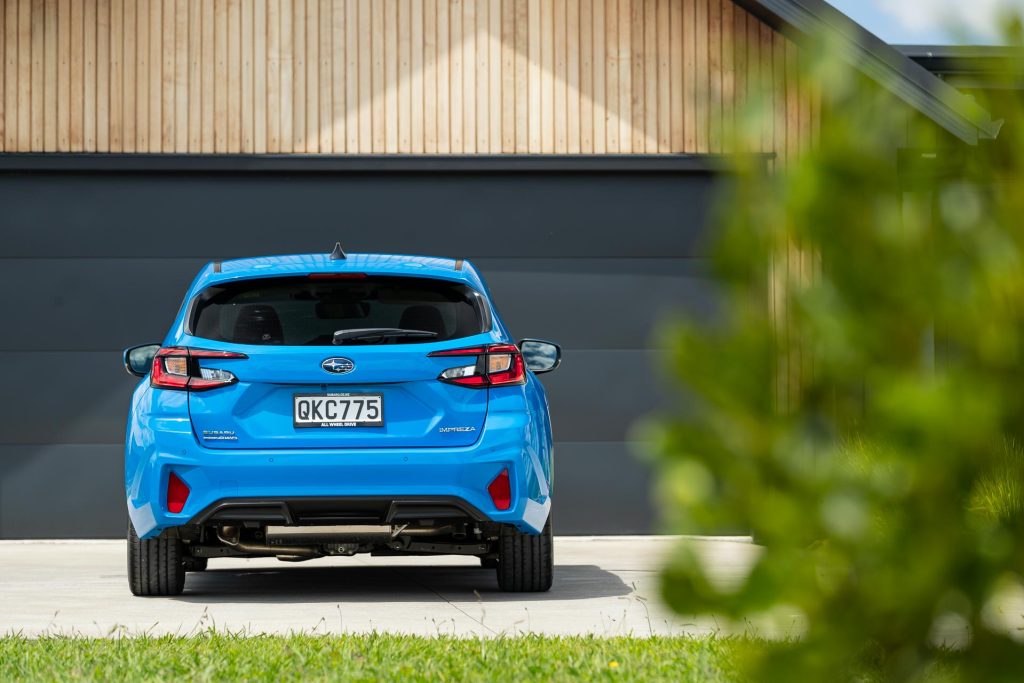 Rear profile of the 2024 Subaru Impreza, in blue