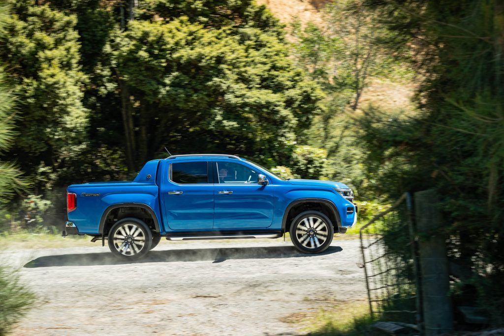 VW Amarok Aventura in blue, driving on a gravel road