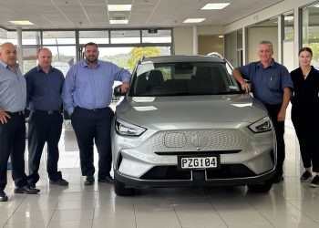 MG Northland team members standing around MG ZS EV