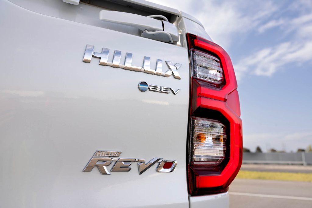 Fully electric Toyota Hilux BEV Revo concept badges close up view