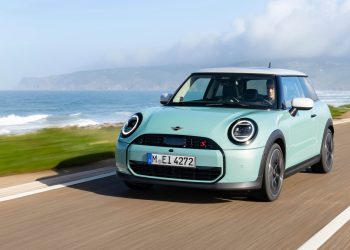 2024 Mini Cooper S driving on road by sea