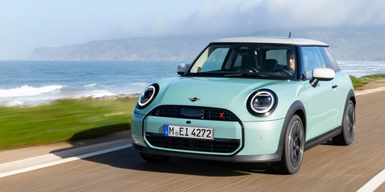 2024 Mini Cooper S driving on road by sea