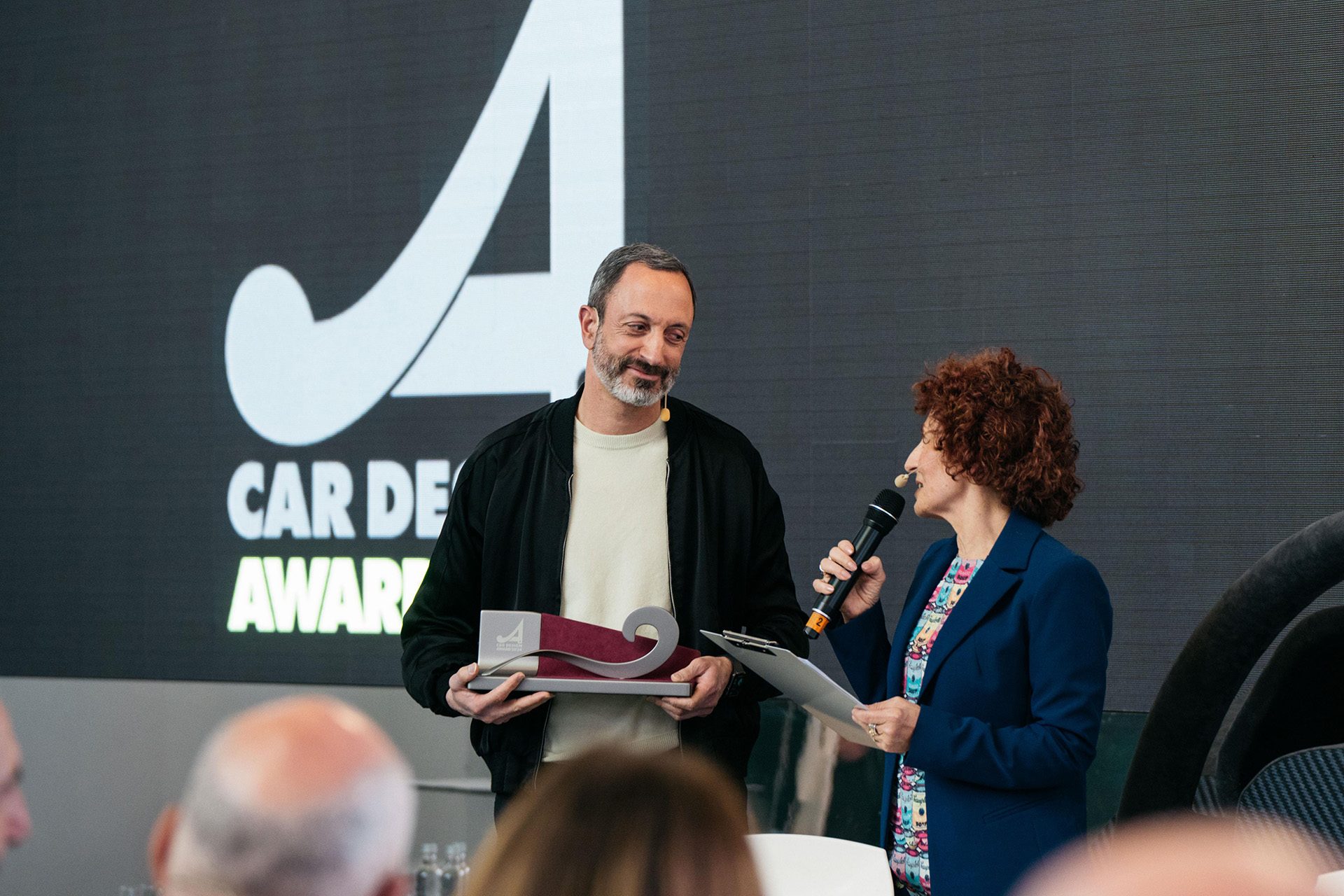 Karim Habib, Kia's Head of Design accepts the "Best Brand Language" award.