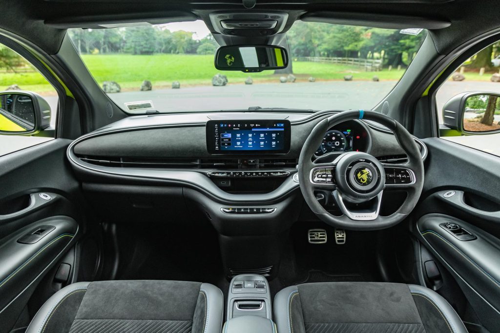 wide interior view shot inside the Abarth 500e Scorpionissima, with alcantara trims