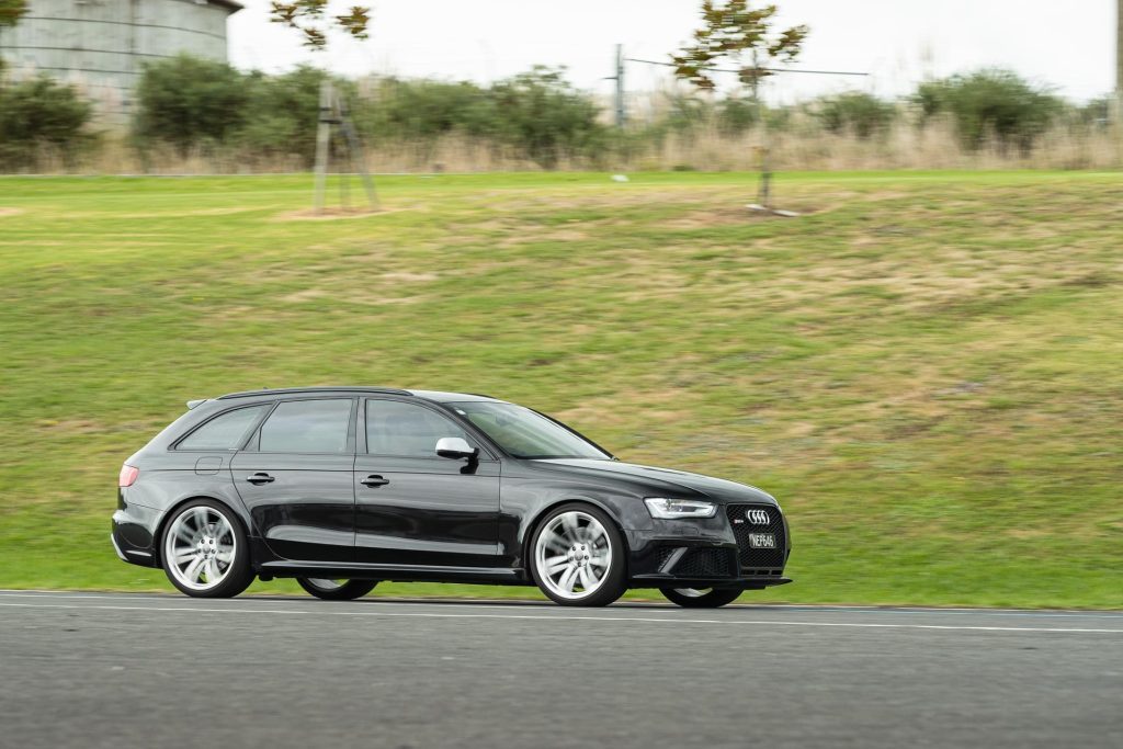 Audi RS4 B8 in black, panning shot