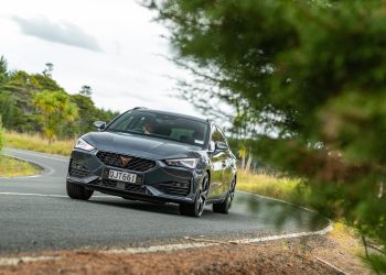 Cupra Leon V e-Hybrid taking a corner at pace