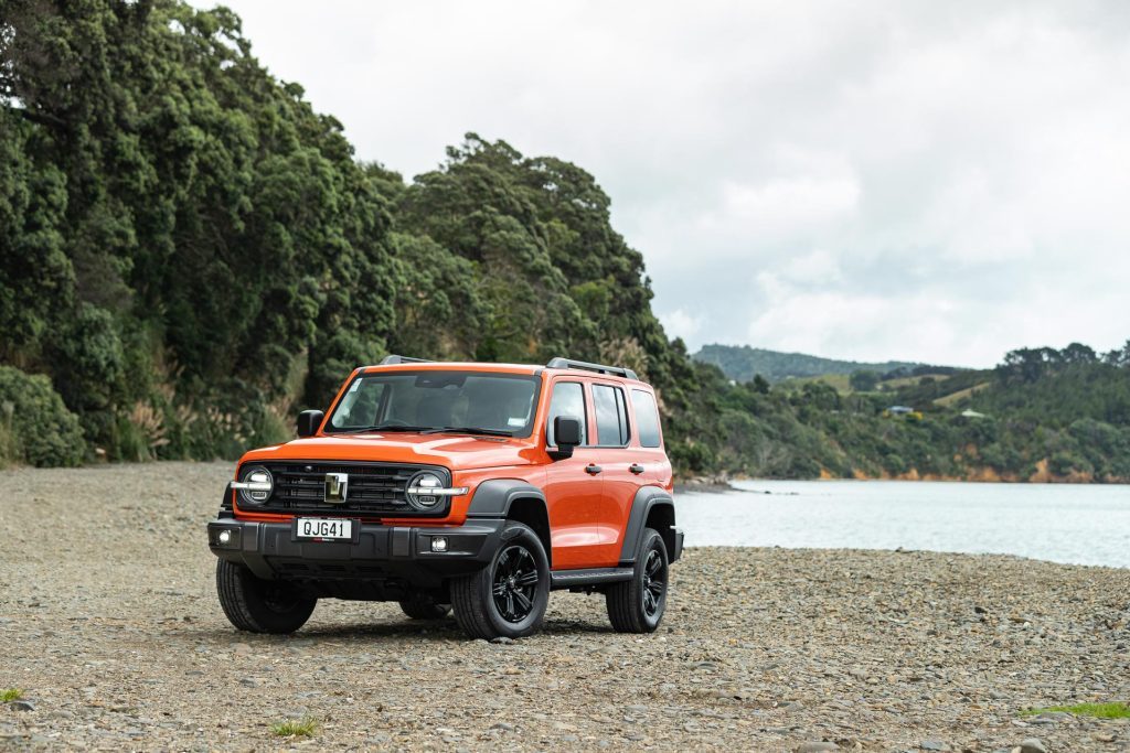 GWM Tank 300 Lux Hybrid in orange, parked at Orere Point, Auckland