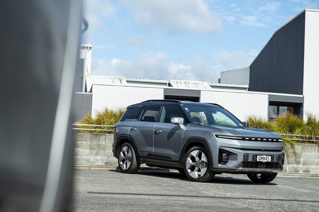 KGM Torres EVX in silver, parked showing the front quarter